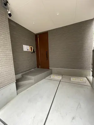 a empty room with two beds in it at MU HOUSE Ikebukuro \u6c60\u888b\u99c5\u8eca1\u5206 in Tokyo