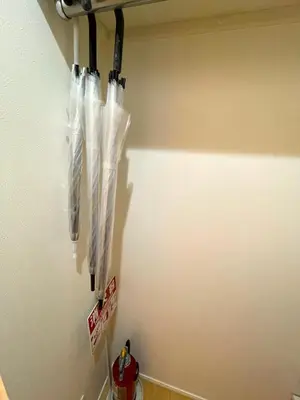 a group of umbrellas hanging on a wall at MU HOUSE Ikebukuro \u6c60\u888b\u99c5\u8eca1\u5206 in Tokyo