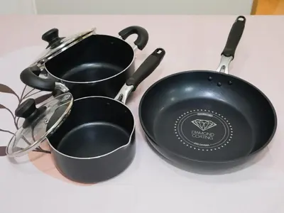 two pans sitting next to each other on a table at Four Seasons Yado 2 in Tokyo