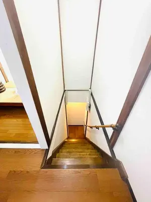 a glass staircase in a room with wooden floors at \u7573\u306e\u9593\u6c60\u888b in Tokyo