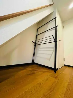 a large white garage with a metal garage door at \u7573\u306e\u9593\u6c60\u888b in Tokyo