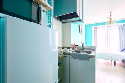 a kitchen with a sink and a refrigerator at K1 4min from nearest station 7min to shinjuku area101 in Tokyo