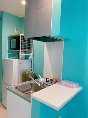 a blue kitchen with a sink and a refrigerator at K1 4min from nearest station 7min to shinjuku area101 in Tokyo