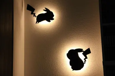 two wall decals on a wall with bats on it at Fun Haven Itabashi in Tokyo