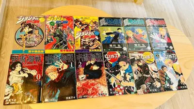 a pile of comics sitting on top of a table at Fun Haven Itabashi in Tokyo