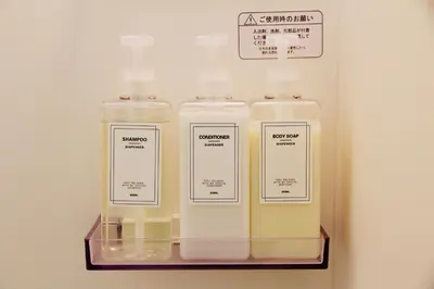 two bottles of soap on a shelf in a room at Fun Haven Itabashi in Tokyo