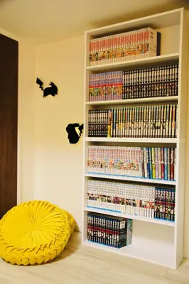 a book shelf filled with lots of dvds at Fun Haven Itabashi in Tokyo