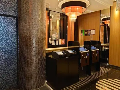 a lobby with a cash register in a store at APA Hotel Shinjuku Kabukicho Tower in Tokyo