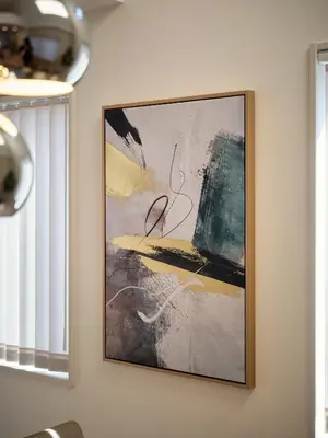a painting hanging on a wall next to a window at LUXU Urban Shinjuku - 4min to Shinjuku, 10min to Shibuya in Tokyo