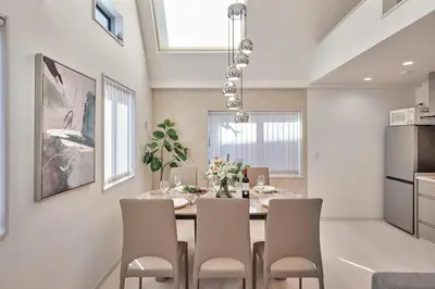 a kitchen and dining room with a table and chairs at LUXU Urban Shinjuku - 4min to Shinjuku, 10min to Shibuya in Tokyo