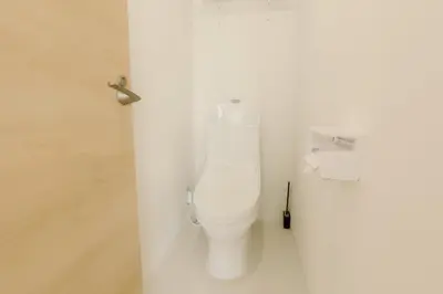 a bathroom with a white toilet in a stall at Aurora 4 in Tokyo