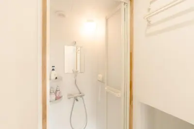 a bathroom with a shower with a shower head at Aurora 4 in Tokyo
