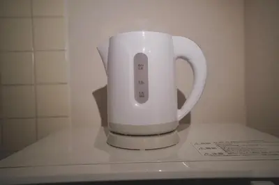 a white mug sitting on top of a counter at \u3055\u304f\u3089\u30b3\u30f3\u30d5\u30a9\u30fc\u30c8 in Tokyo
