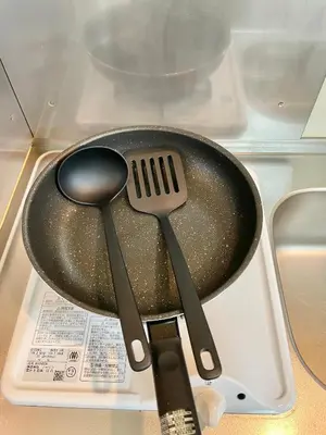 two spatulas and a frying pan in a refrigerator at YMK Oshiage 3A in Tokyo
