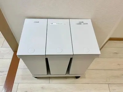 two white refrigerators are stacked on top of each other at YMK Oshiage 3A in Tokyo