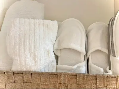 a pair of white shoes and a white towel at Shiro HAKU in Tokyo