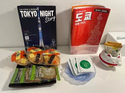 a table with some snacks and a book and a toy at Shiro HAKU in Tokyo