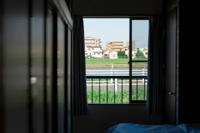 a window in a room with a view of a street at Renovated House Crossroads Katsushika in Tokyo