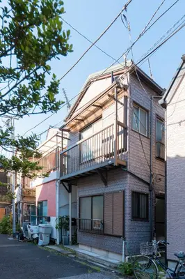 an apartment building with a balcony on a street at Renovated House Crossroads Katsushika in Tokyo