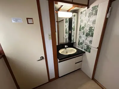 a bathroom with a sink and a mirror at 西巣鴨 Cozy for 4-12guests 3BR House-3Showers &3Toilets in Tokyo