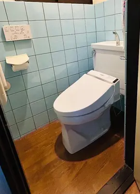 a bathroom with a white toilet and a sink at 西巣鴨 Cozy for 4-12guests 3BR House-3Showers &3Toilets in Tokyo