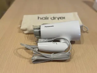 a hair dryer sitting on top of a table at Stay&resort Luce ルーチェ in Urayasu