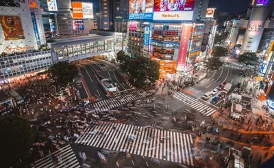 a busy city street at night with traffic and pedestrians at NEW! Shibuya Square Prime Unit, Heart of Tokyo! in Tokyo
