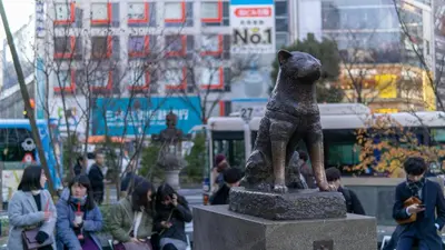 a statue of a dog in a city at NEW! Shibuya Square Prime Unit, Heart of Tokyo! in Tokyo