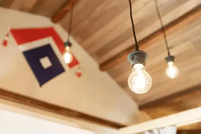 a light bulb is hanging from a ceiling at \u5343\u5bff\u5bbf \u7384 in Tokyo
