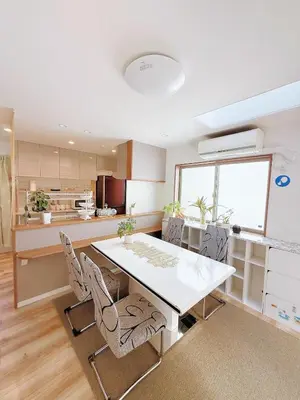 a kitchen and dining room with a table and chairs at keisei koiwa little garden in Tokyo