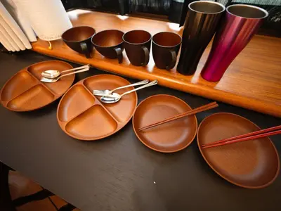 a group of brown plates and cups on a table at The Nest Koenji Cozy Stay near Station Easy Access to Shinjuku in Tokyo