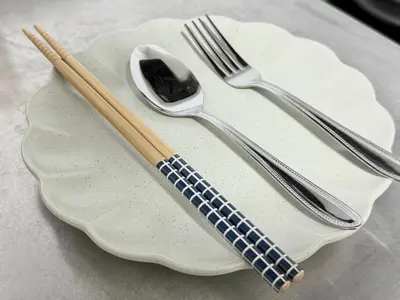 a plate with two forks and a spoon on it at \u685c\u5357\u5927\u585a\u30cf\u30a6\u30b9ii in Tokyo