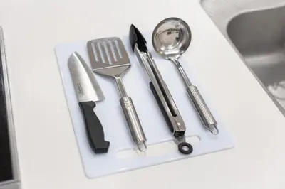 a group of kitchen utensils on a white tray at Downtown Mix in Tokyo