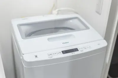 a white washer and dryer in a refrigerator at Downtown Mix in Tokyo