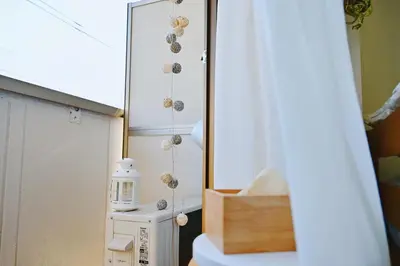 a room with a toilet and a table with a lamp at Subway 2min Skytree#6min Asakusa in Tokyo