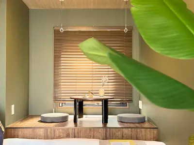 a table and two stools in a room with a window at nestay apartment tokyo komagome in Tokyo