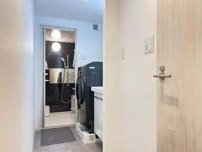 a bathroom with a walk in shower and a sink at nestay apartment tokyo komagome in Tokyo