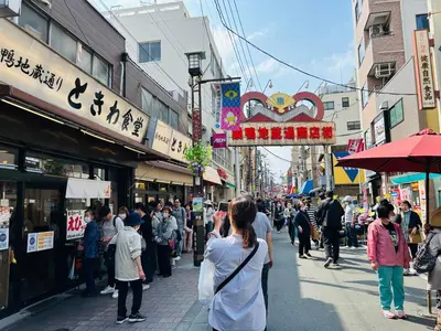 a crowd of people walking down a busy city street at \u6c60\u888bHouse2F Cozy for 1-3 guests in Tokyo