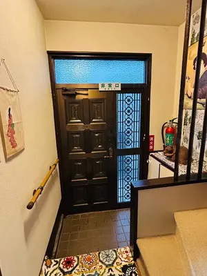 aoyer with a black door with a mat in front at \u6c60\u888bHouse3F Cozy for 1-3 guests in Tokyo