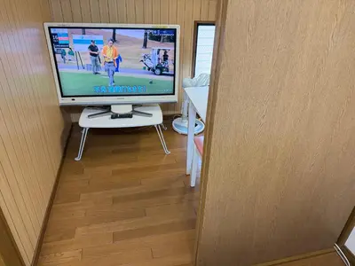 a television sitting on a table in a room at \u6c60\u888bHouse3F Cozy for 1-3 guests in Tokyo