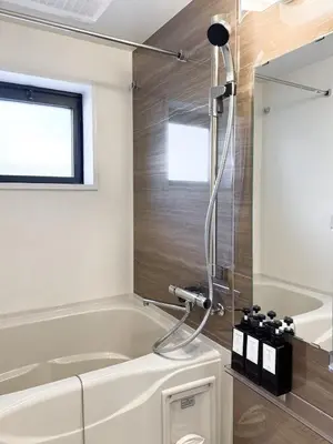 a bathroom with a tub and a shower at Triphome Shinjuku East 4F in Tokyo