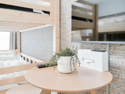 a small table in a room with a bed at Triphome Nakano 2025 Bunk bed in Tokyo