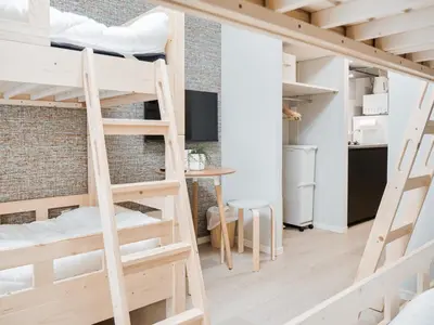 a room with two bunk beds and a desk at Triphome Nakano 2025 Bunk bed in Tokyo