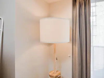 a lamp sitting on a table next to a window at Triphome Nakano 2025 Bunk bed in Tokyo