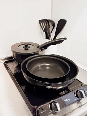a pan sitting on top of a stove at Triphome Nakano 2025 Green in Tokyo