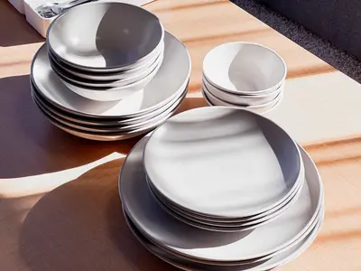 a group of white plates and bowls on a table at Triphome Nakano 2025 Green in Tokyo