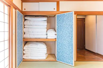 a closet filled with lots of white towels at Poka villa aoyama - Vacation STAY 19050 in Tokyo