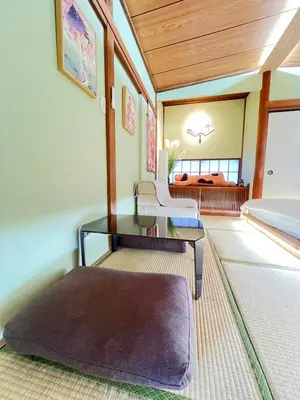 a living room with a table and a couch at Takara\u8c4a\u5cf6\u5712101 NR0434 in Tokyo