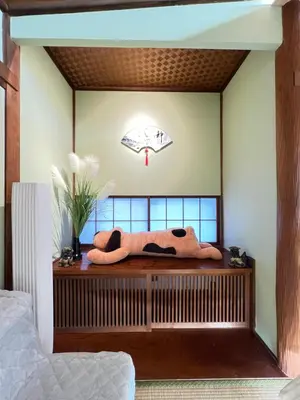 a bedroom with a bed with a pillow on a table at Takara\u8c4a\u5cf6\u5712101 NR0434 in Tokyo