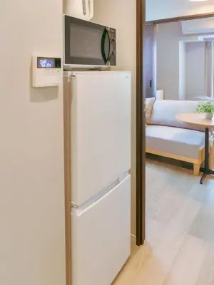 a white refrigerator with a tv on top of it at Triphome Nakano 2025 Cozy in Tokyo